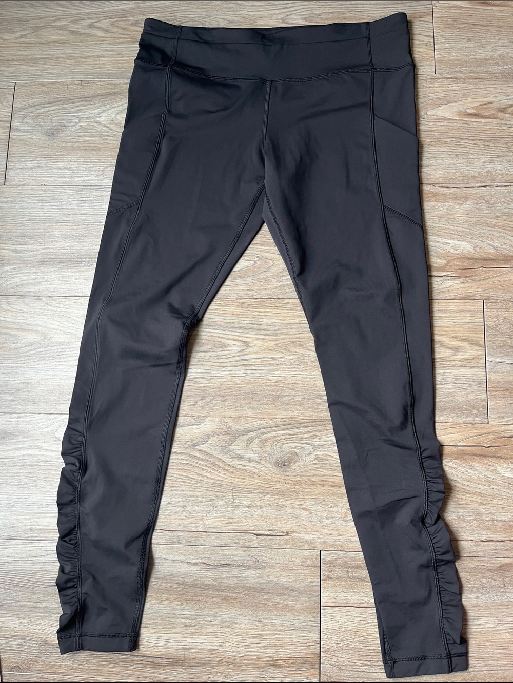 Lululemon Speed Tight Cozy Black with side pockets and beautiful ruffles on leg